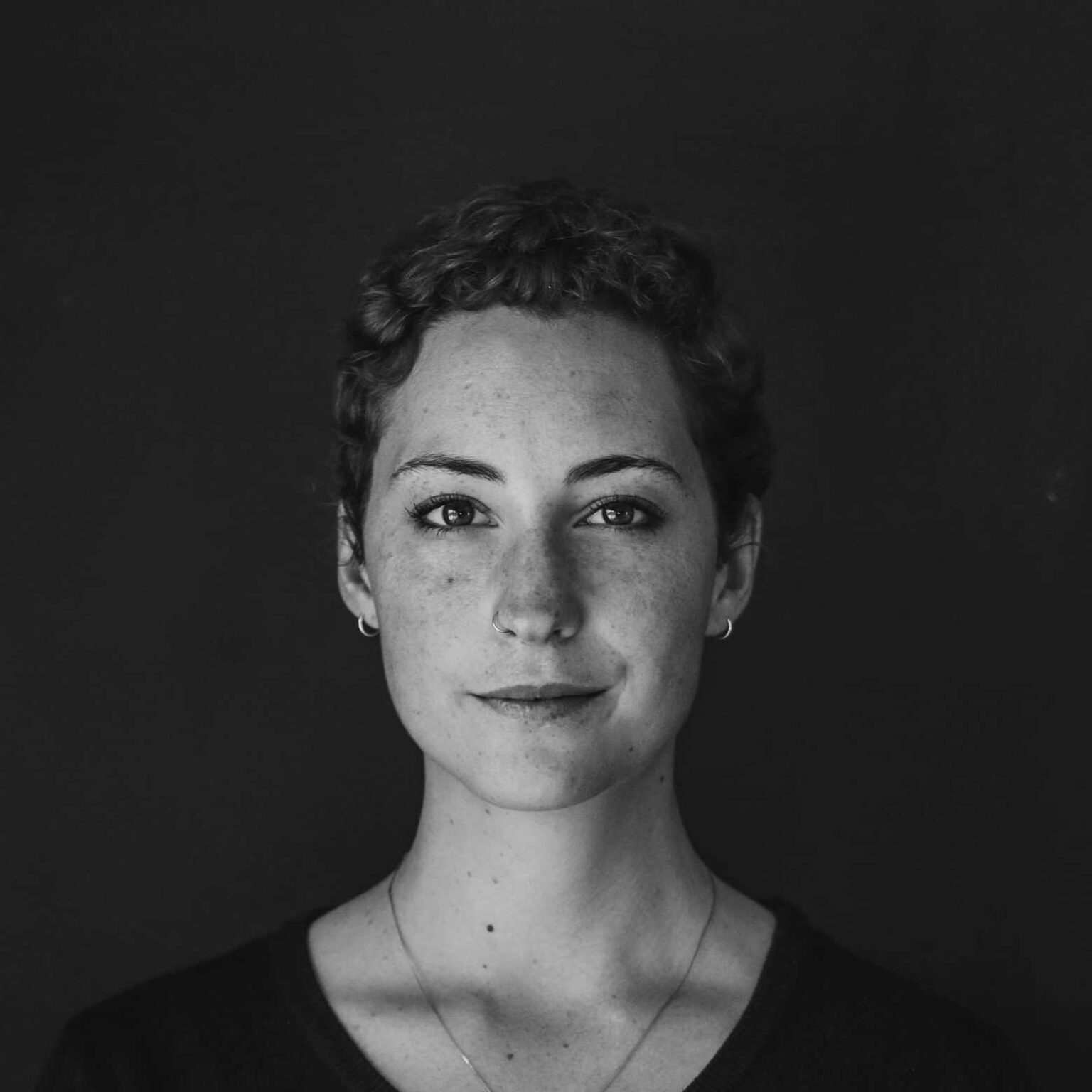 black and white image of a woman with a slight smile